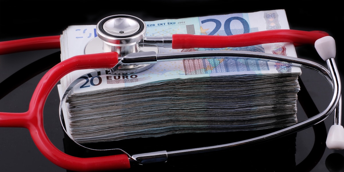 Stethoscope on money representing healthcare cost burden